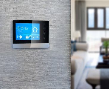 A smart thermostat inside a home.